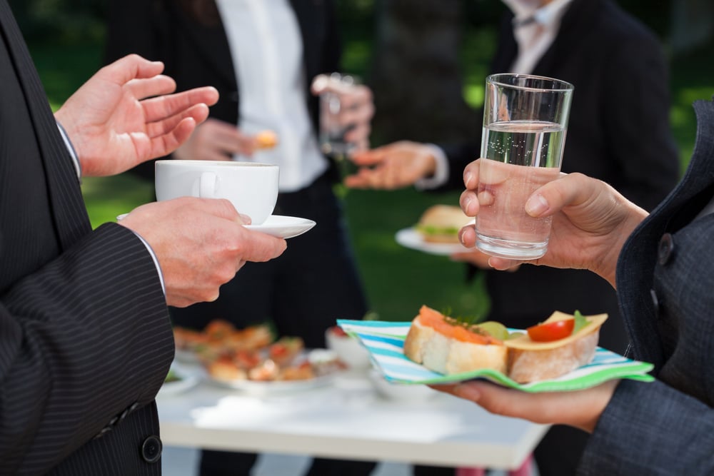 Business people at the meeting at the lunch buffet Business people at the meeting at the lunch buffet